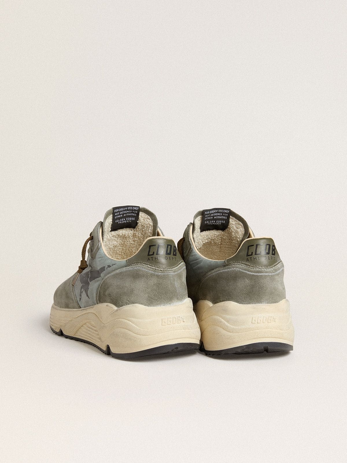 Men's Running Sole in light blue nylon with black star and green leather heel tab