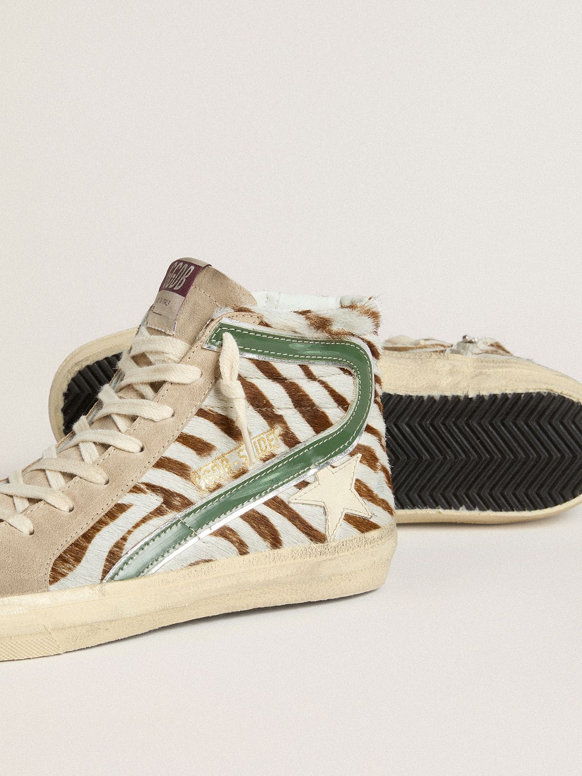 Women's Slide in zebra-print pony skin with green laminated leather flash