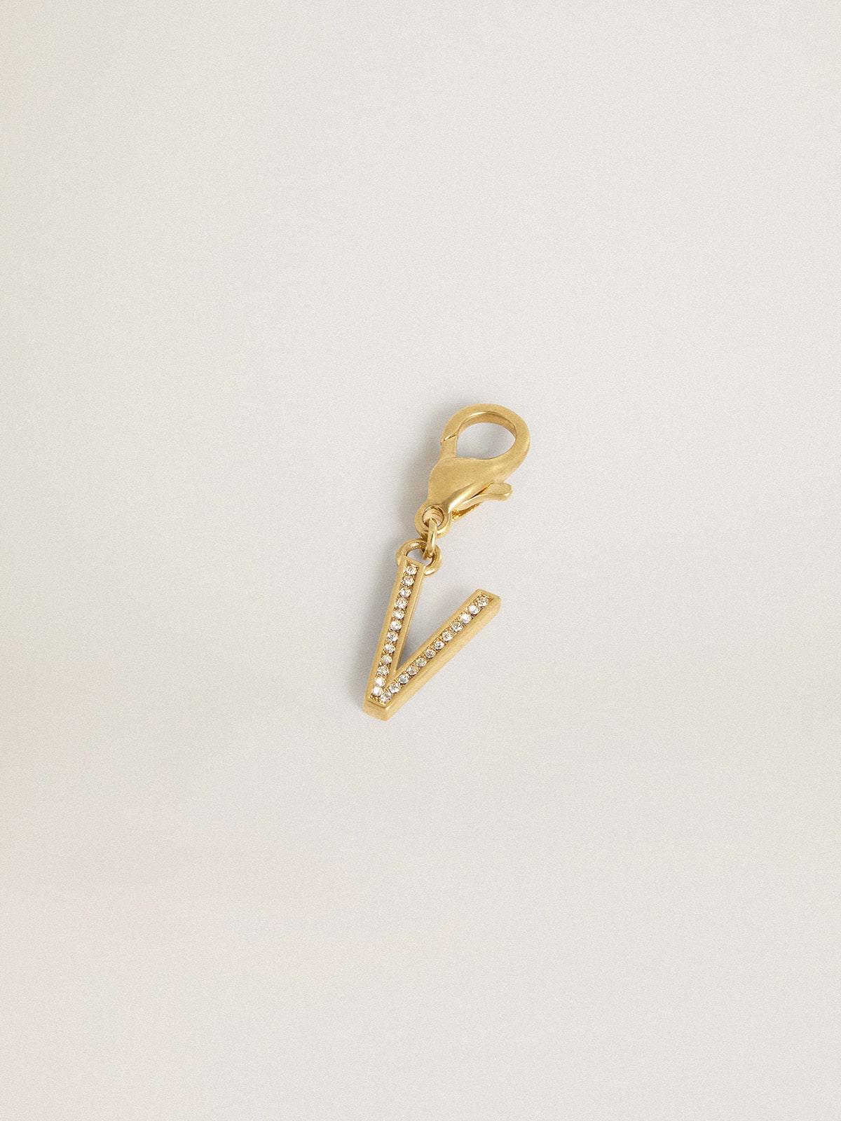 Letter V charm in gold-colored brass with crystals