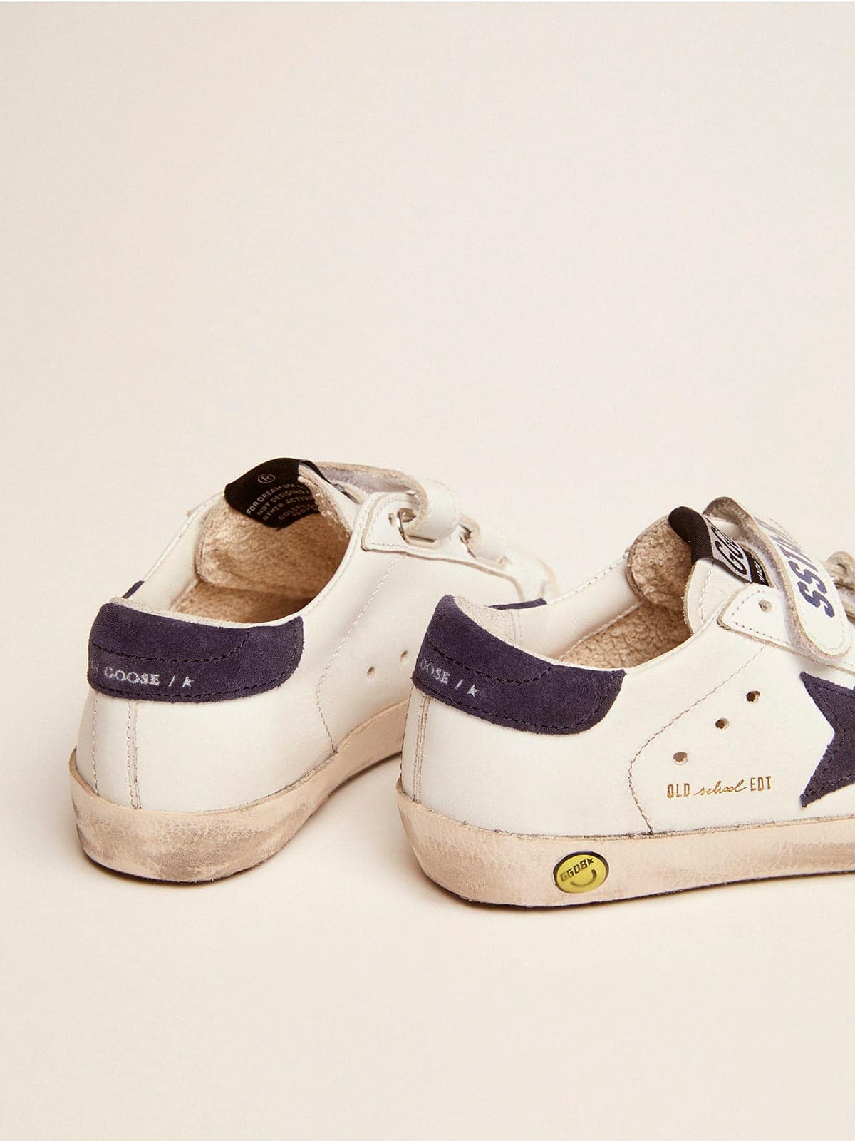 Junior Old School in white leather with blue suede star and heel tab
