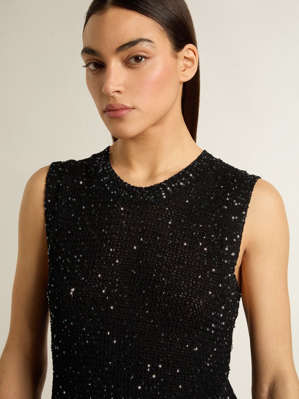 Black mesh knit top with sequins and contrasting details
