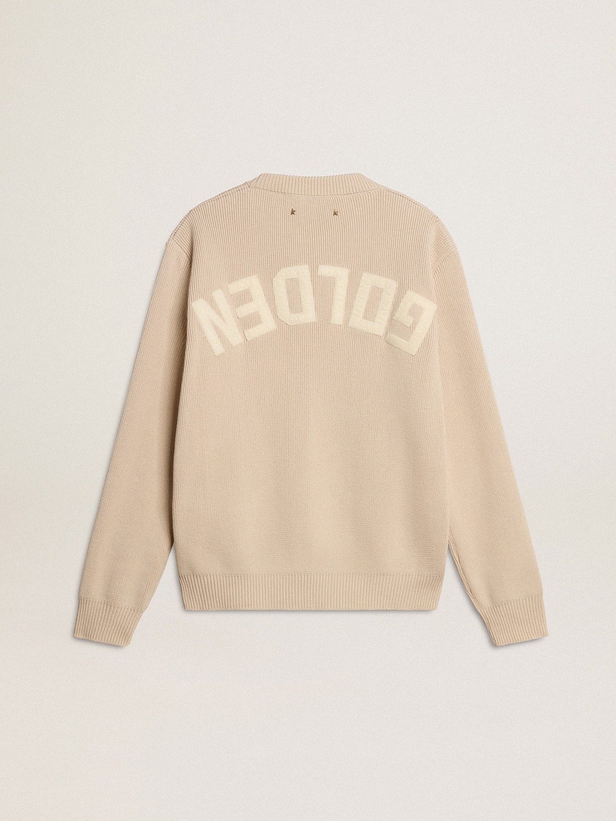 Women's beige sweater with 'Golden' lettering on the back