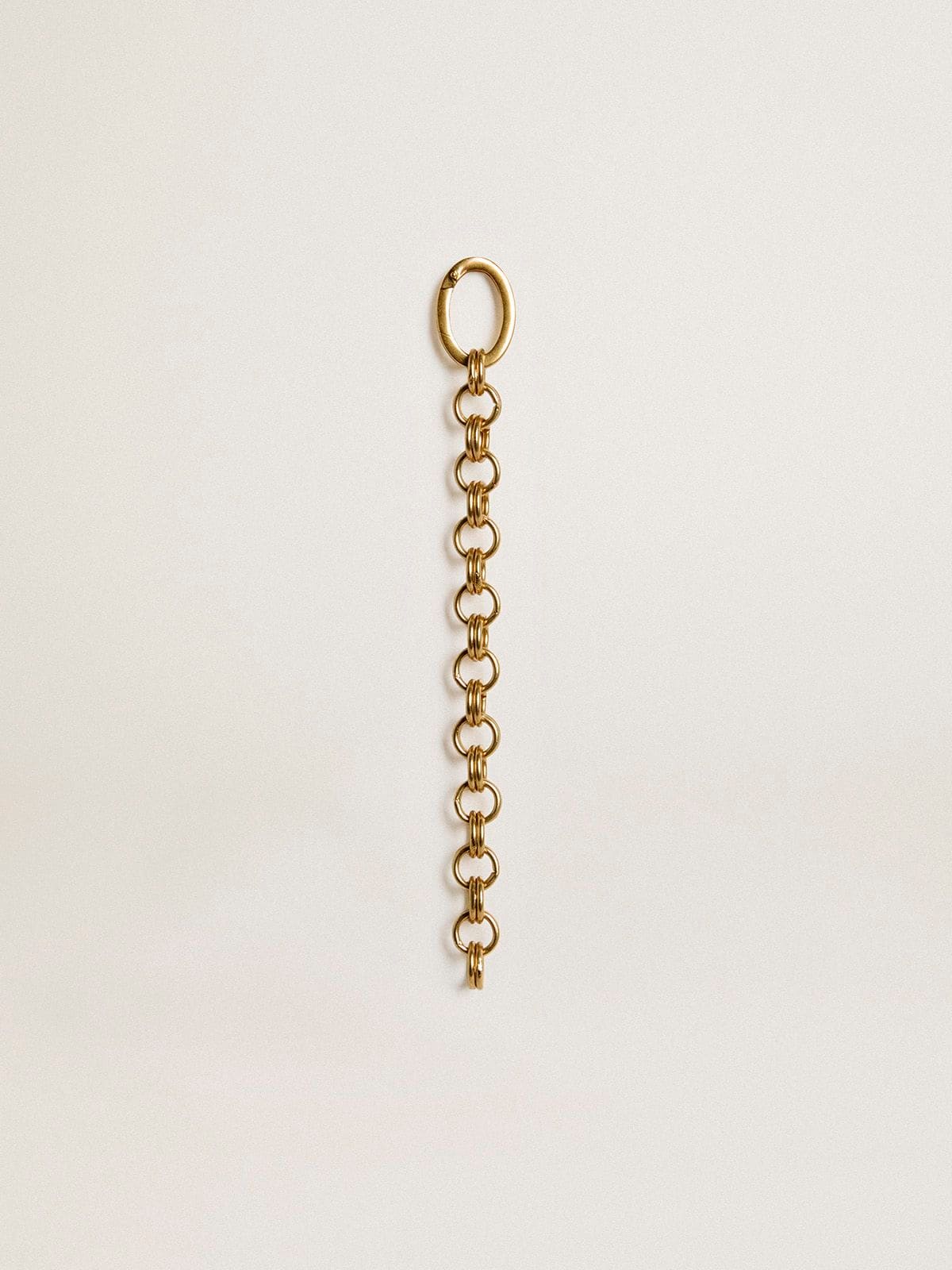 Antique gold-colored brass charm in the shape of a chain