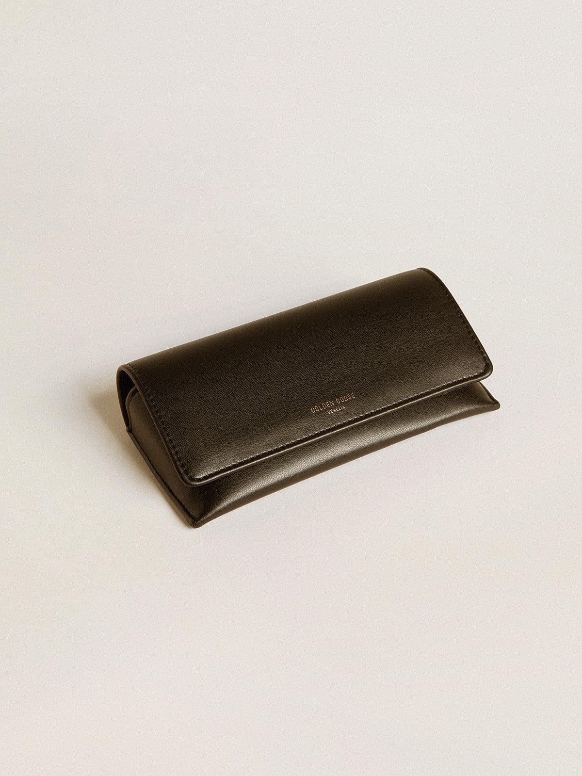 Aviator style sunglasses with black frame and lenses