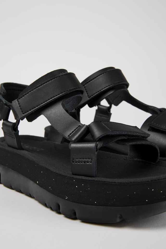 Oruga Up Black leather sandals for women