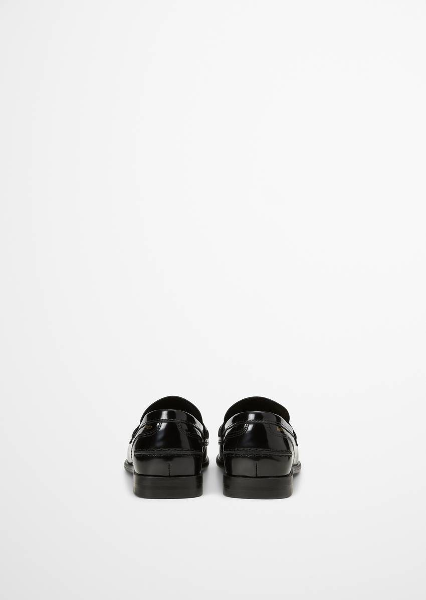 Penny loafer made of patent leather with coin