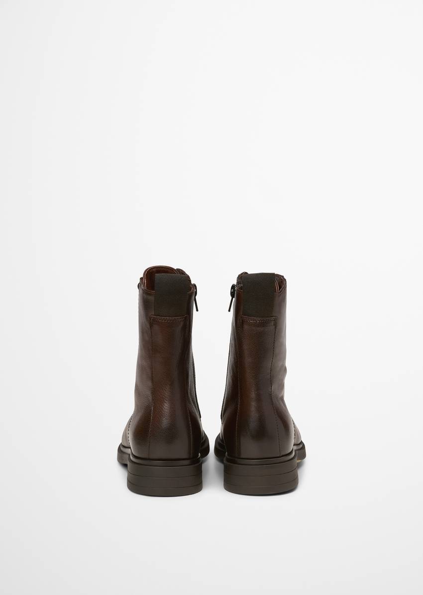 Lace-up boots with practical inside zipper