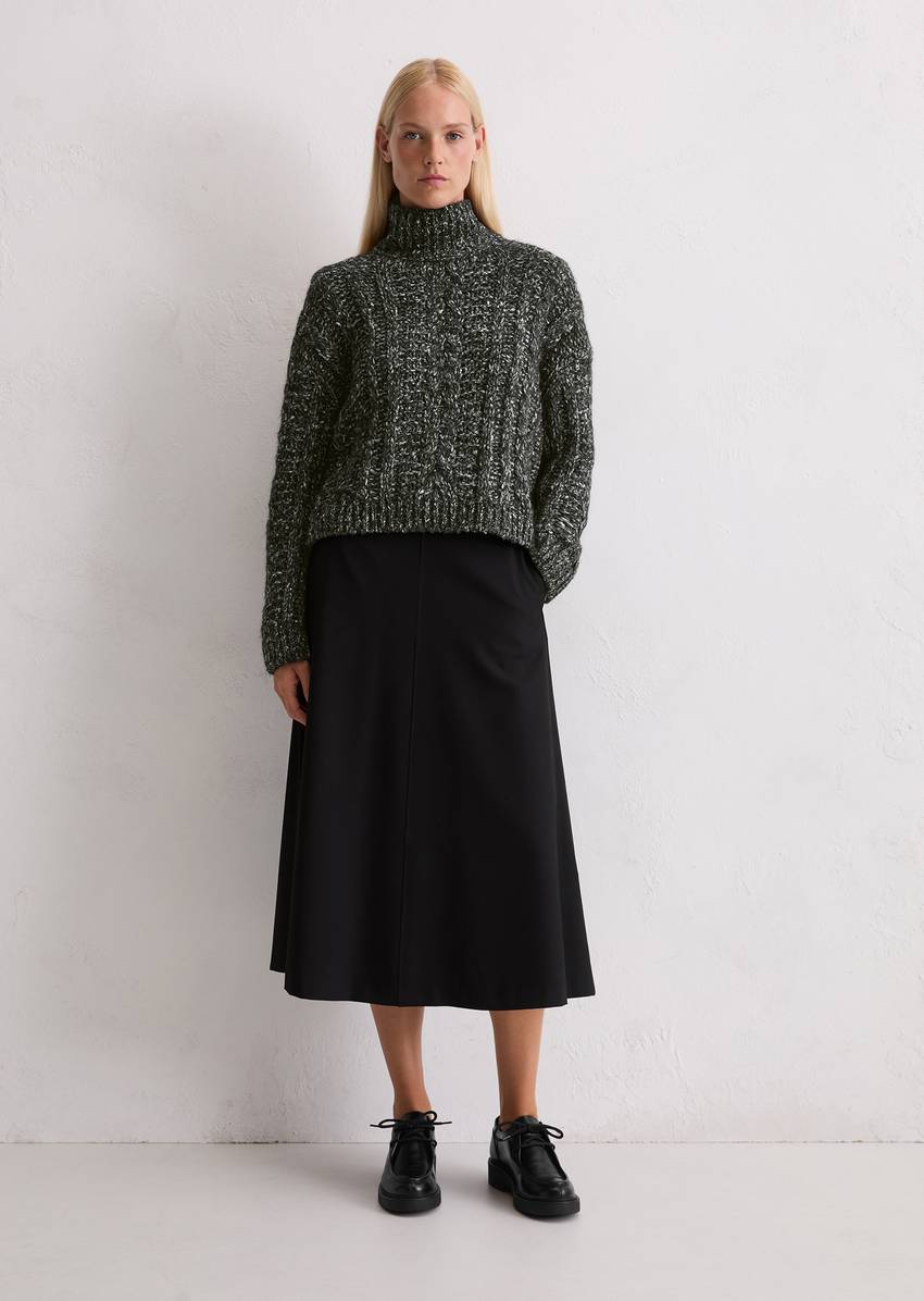 Cable knit oversized sweater made from a mix of alpaca wool, cotton and merino wool