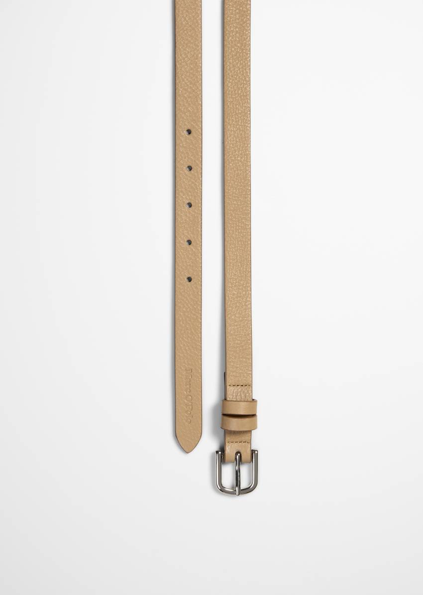 Belt with shiny metal buckle