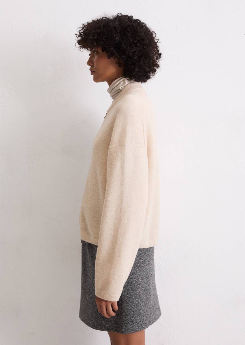 Knitted blouson loose made from a virgin wool/alpaca wool mix