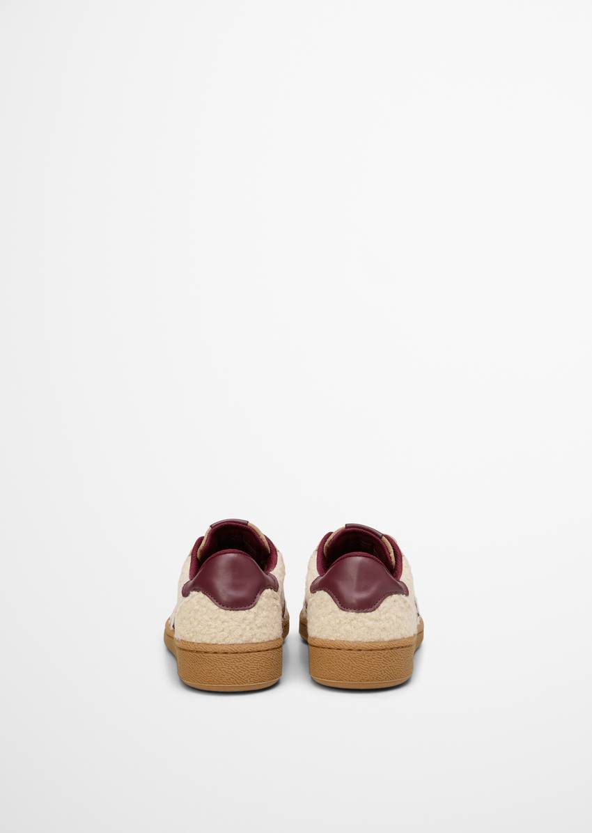 Sneaker made of leather and teddy fur