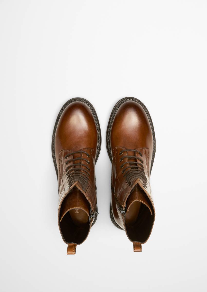 Lace-up boots with practical inside zipper