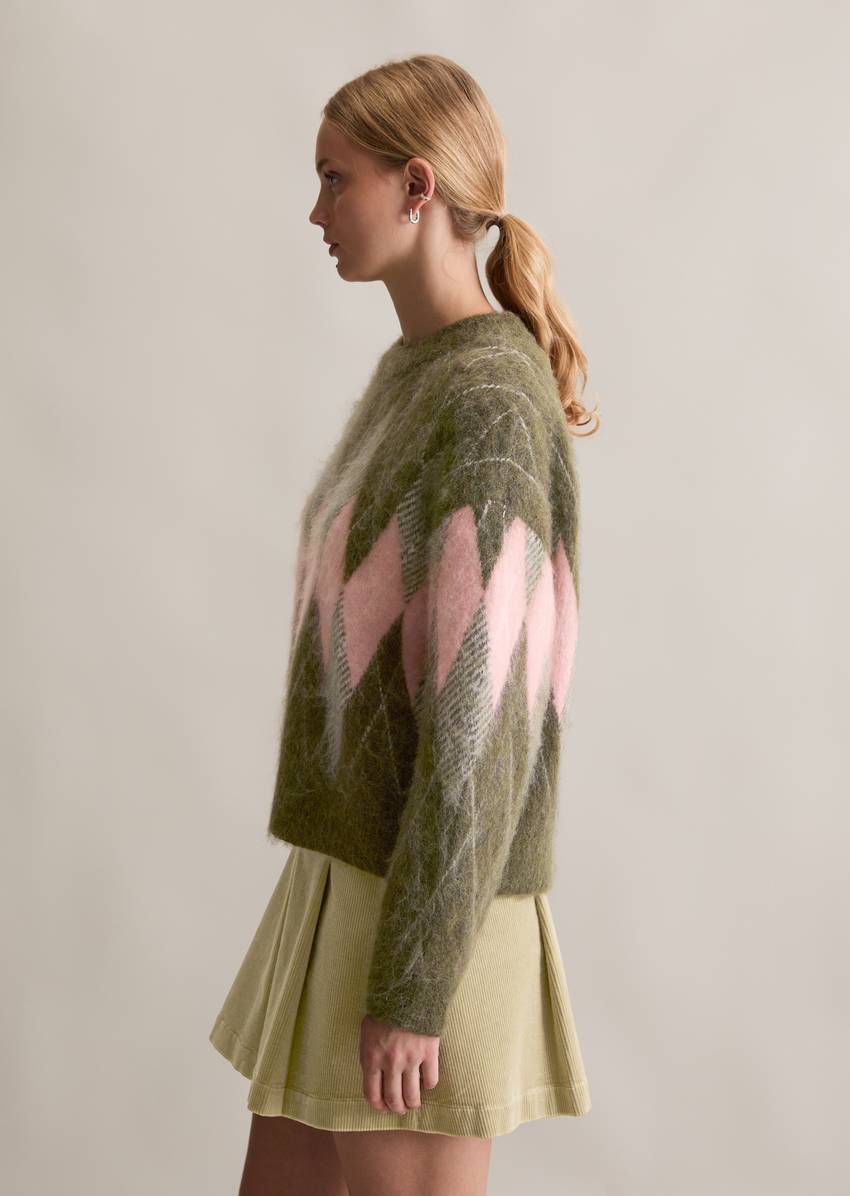 Relaxed knit sweater made from a cozy virgin wool and mohair blend