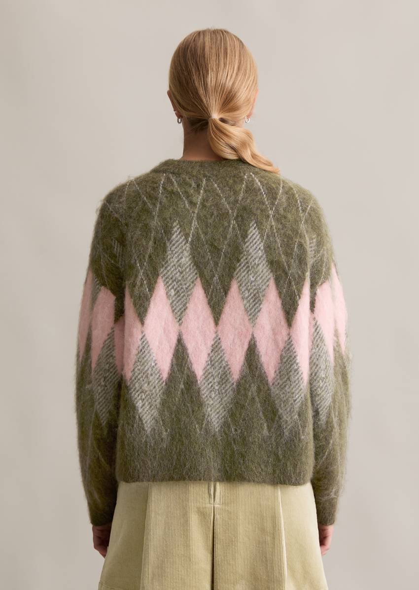 Relaxed knit sweater made from a cozy virgin wool and mohair blend