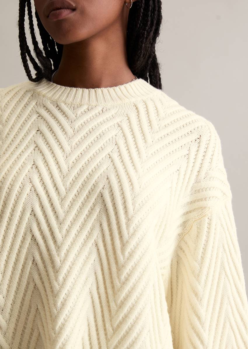 Relaxed knit sweater made from a soft virgin wool blend