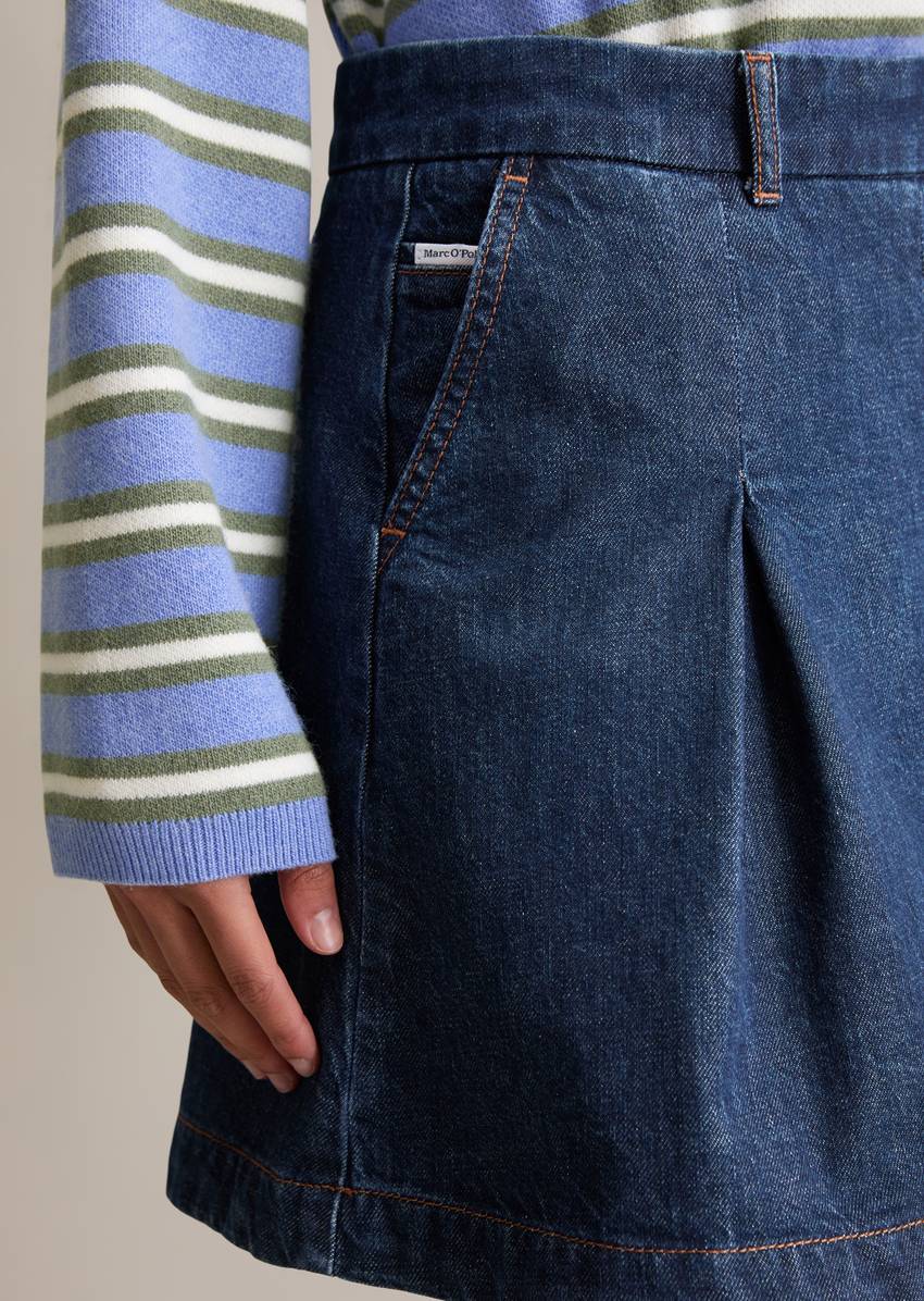 Denim pleated mini skirt made from rigid denim