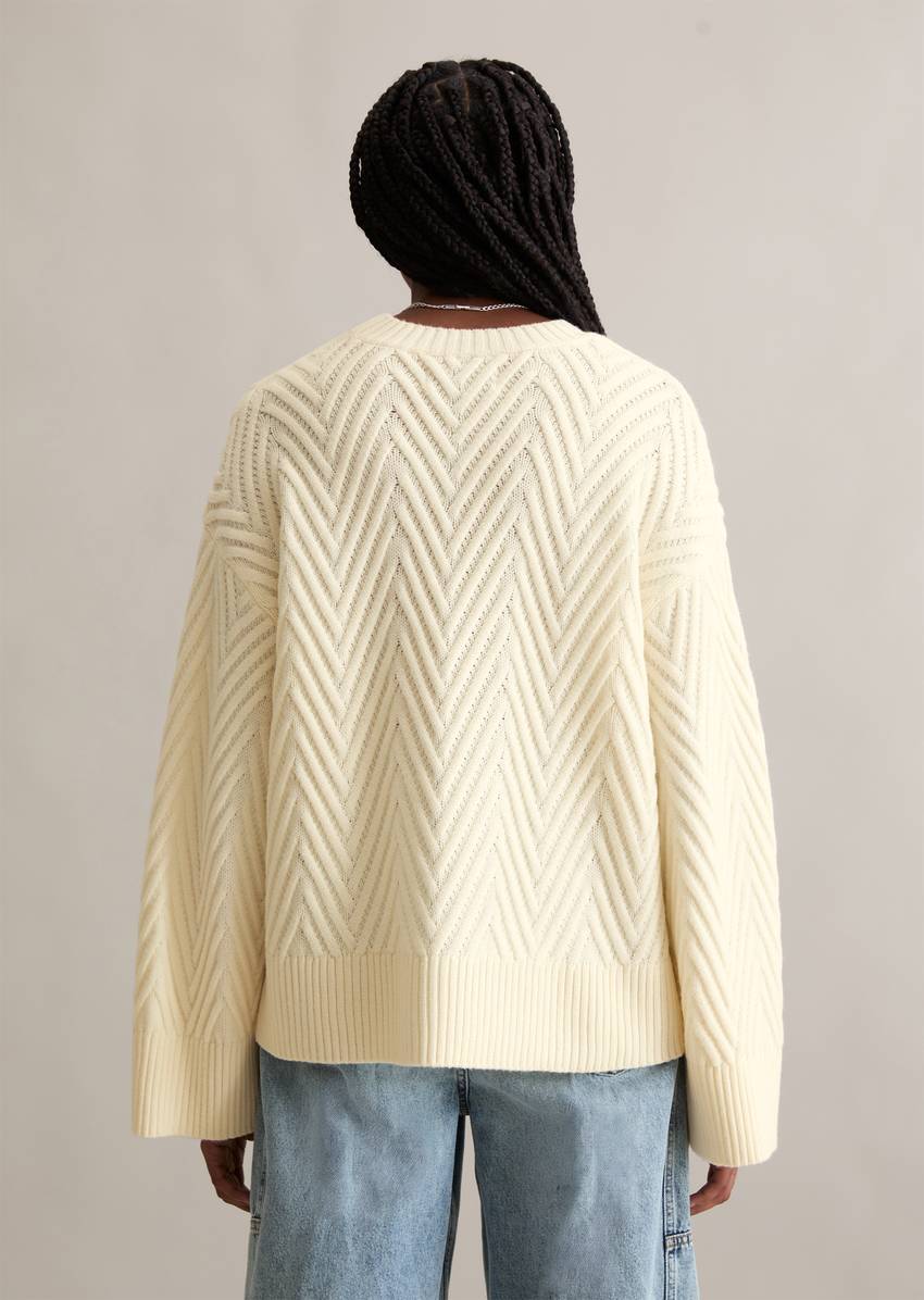 Relaxed knit sweater made from a soft virgin wool blend