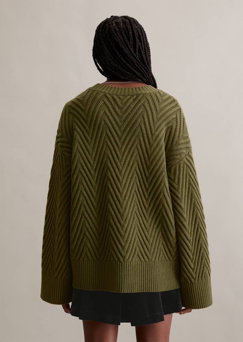 Relaxed knit sweater made from a soft virgin wool blend