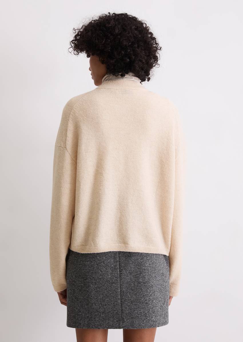 Knitted blouson loose made from a virgin wool/alpaca wool mix