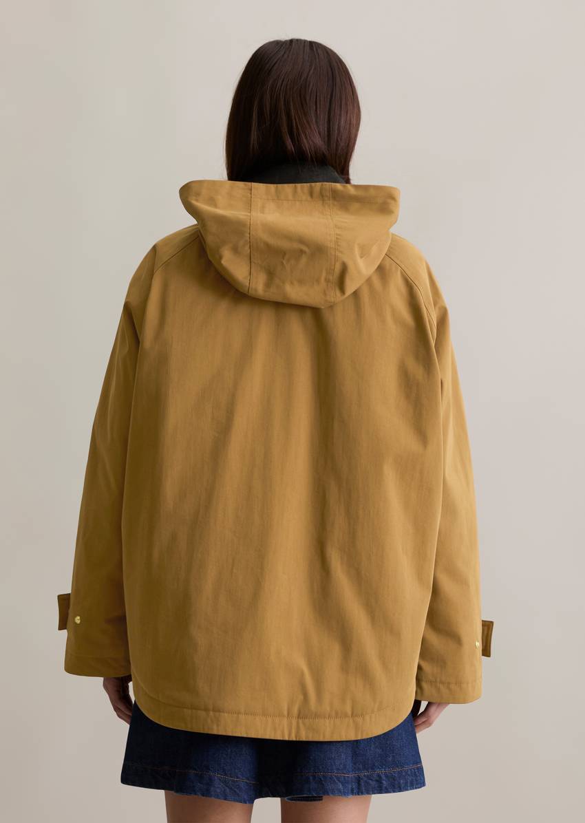 Oversize padded barn jacket made from a waxed organic cotton-nylon mix