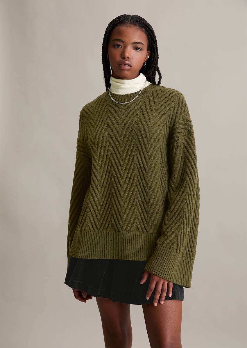 Relaxed knit sweater made from a soft virgin wool blend