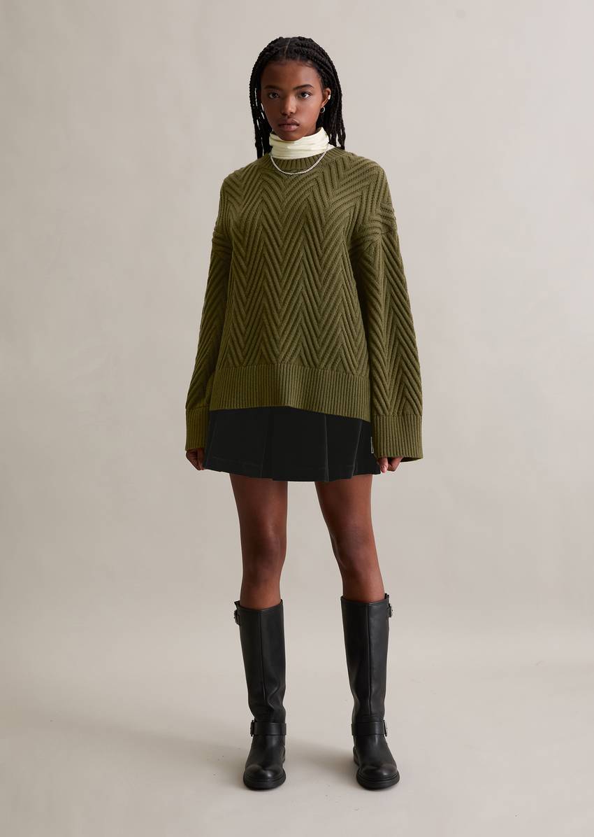 Relaxed knit sweater made from a soft virgin wool blend