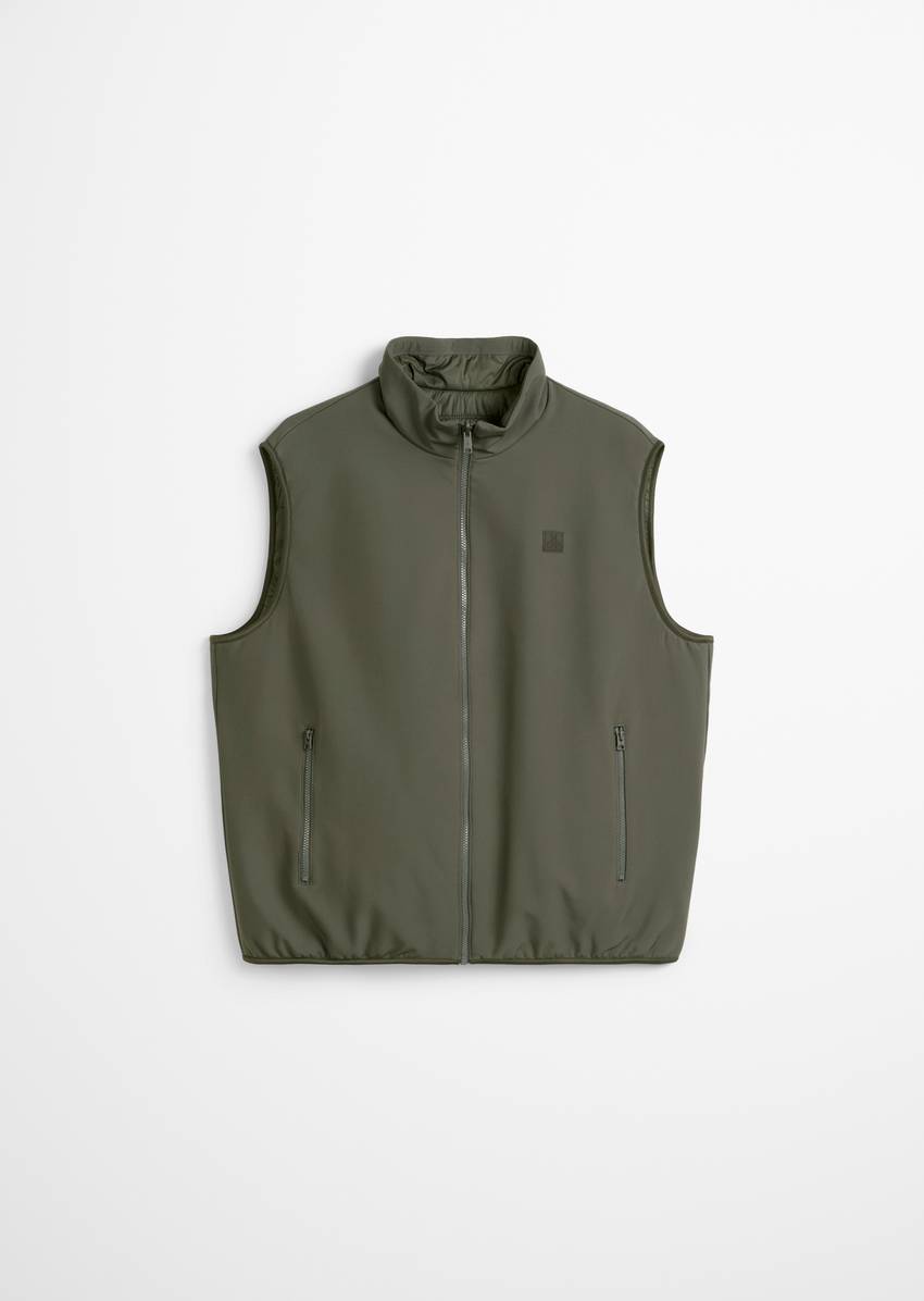 Reversible vest made from softshell and quilting