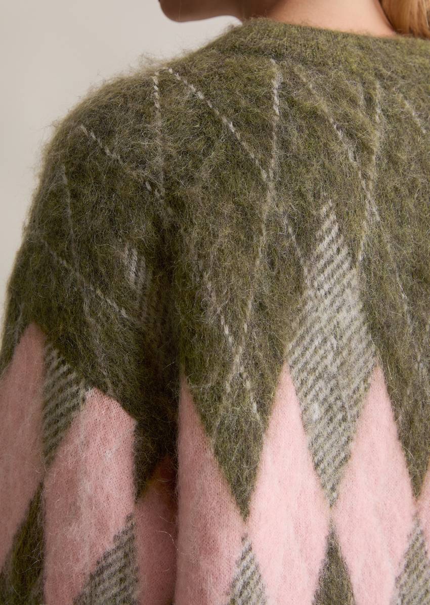 Relaxed knit sweater made from a cozy virgin wool and mohair blend