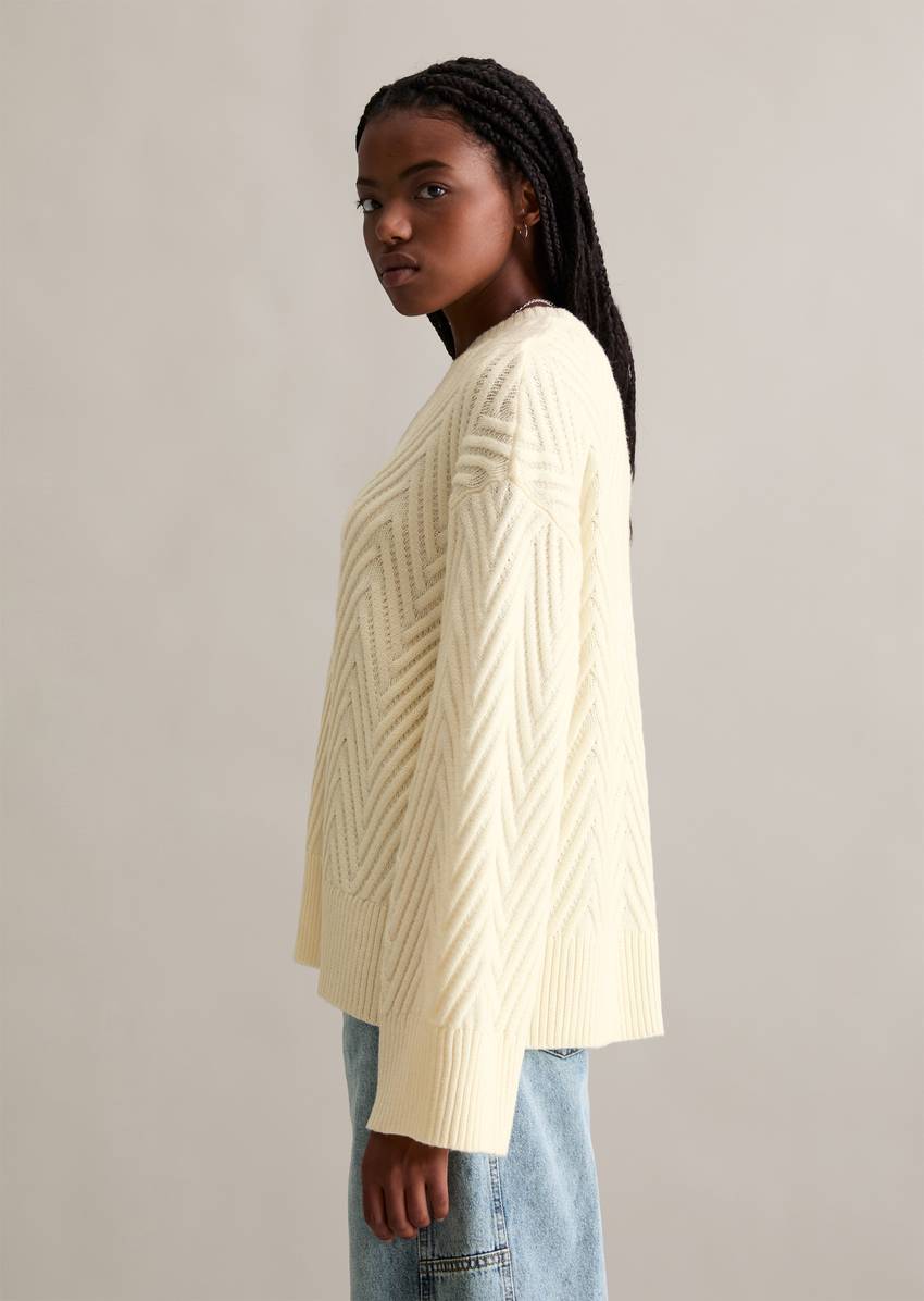 Relaxed knit sweater made from a soft virgin wool blend