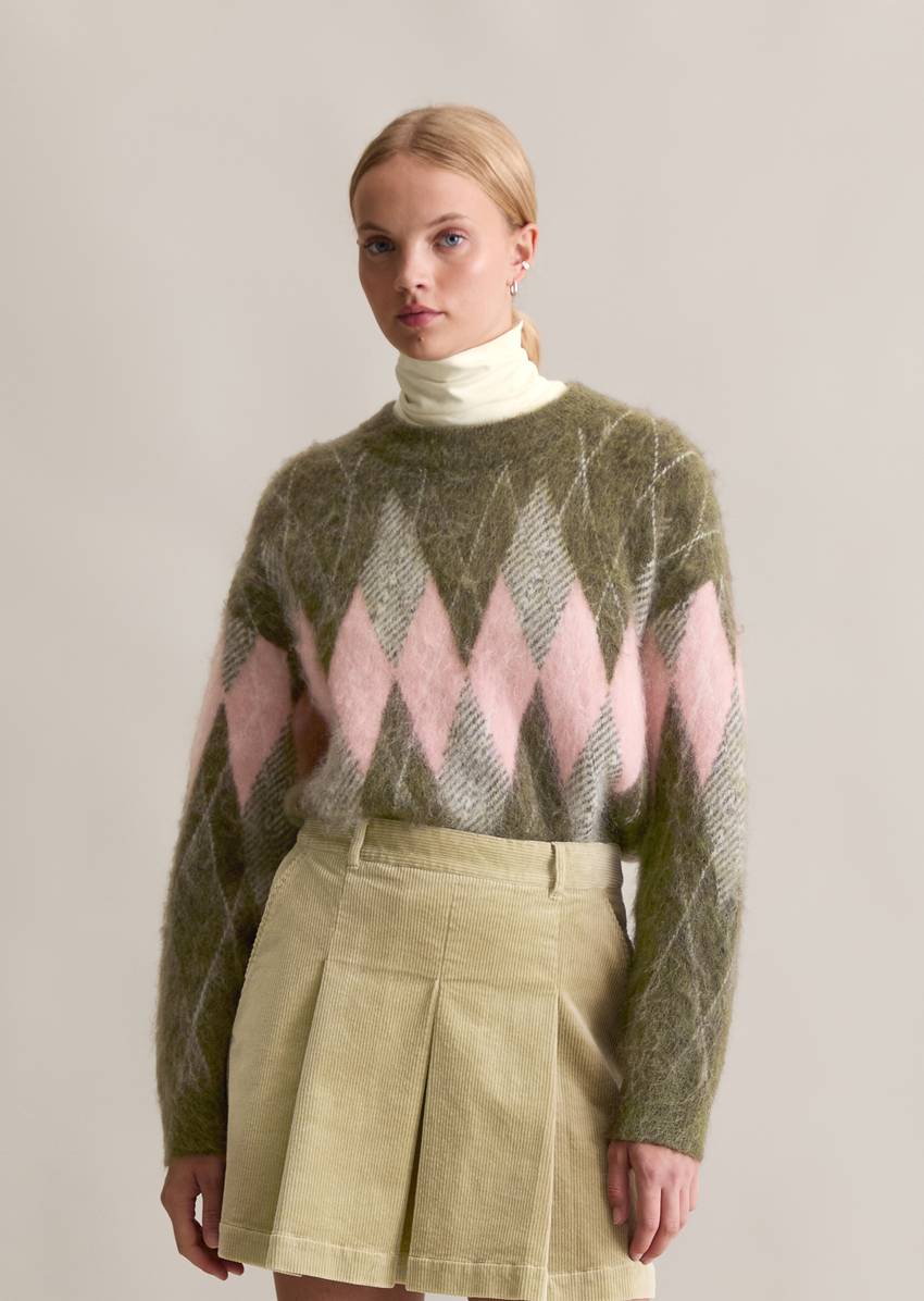 Relaxed knit sweater made from a cozy virgin wool and mohair blend