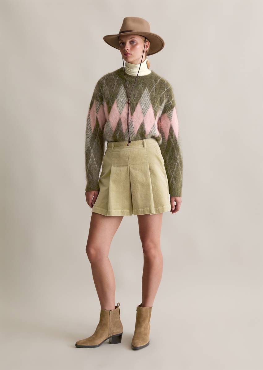 Relaxed knit sweater made from a cozy virgin wool and mohair blend