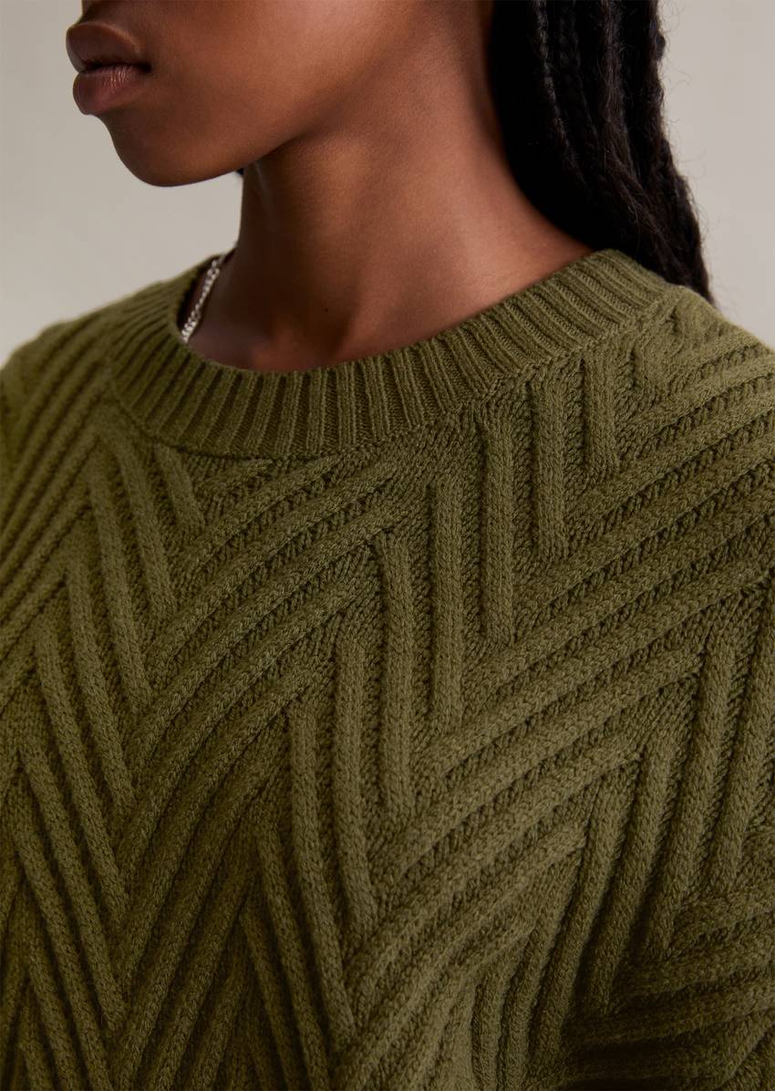 Relaxed knit sweater made from a soft virgin wool blend
