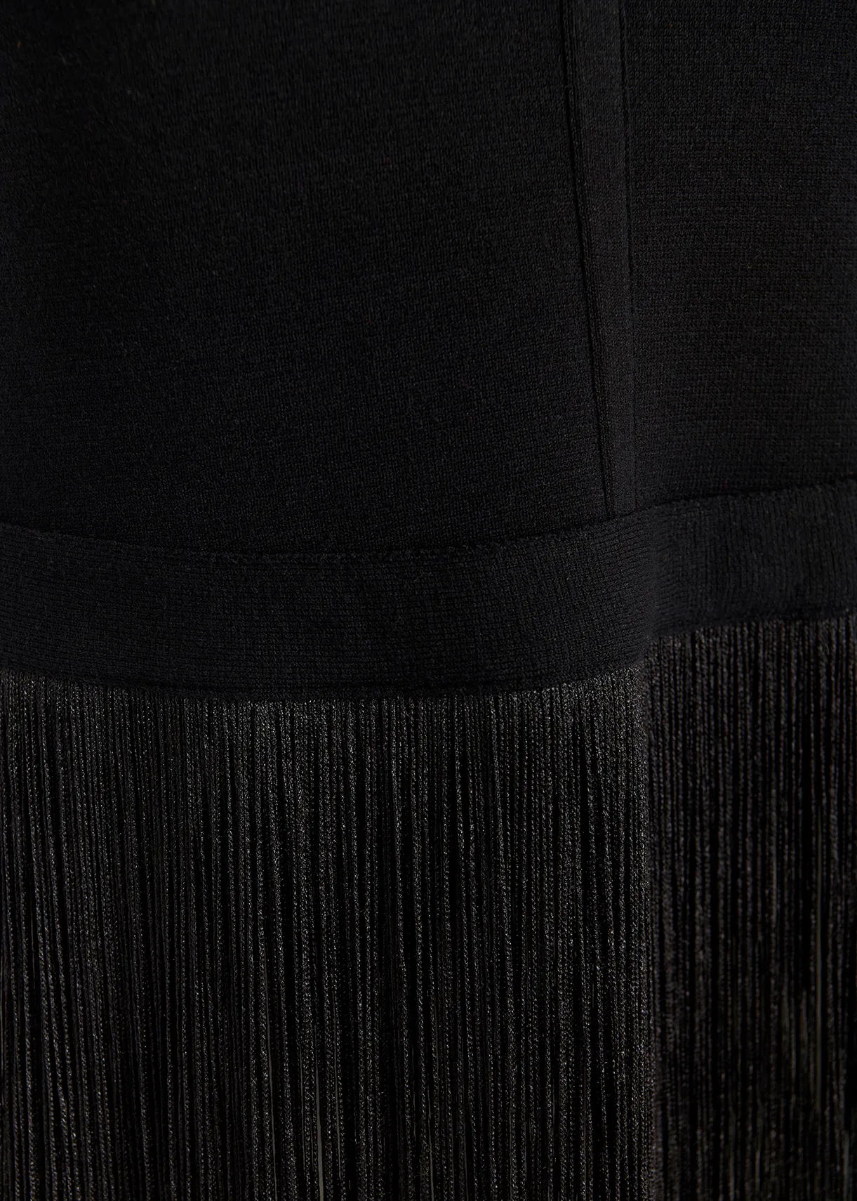 Black knitted top with long fringes