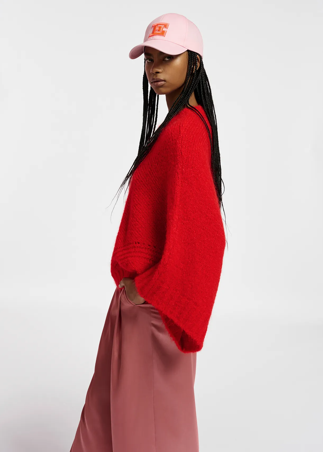 Red knit sweater with cape effect