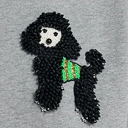Grey organic cotton sweatshirt with bead-embroidered poodle