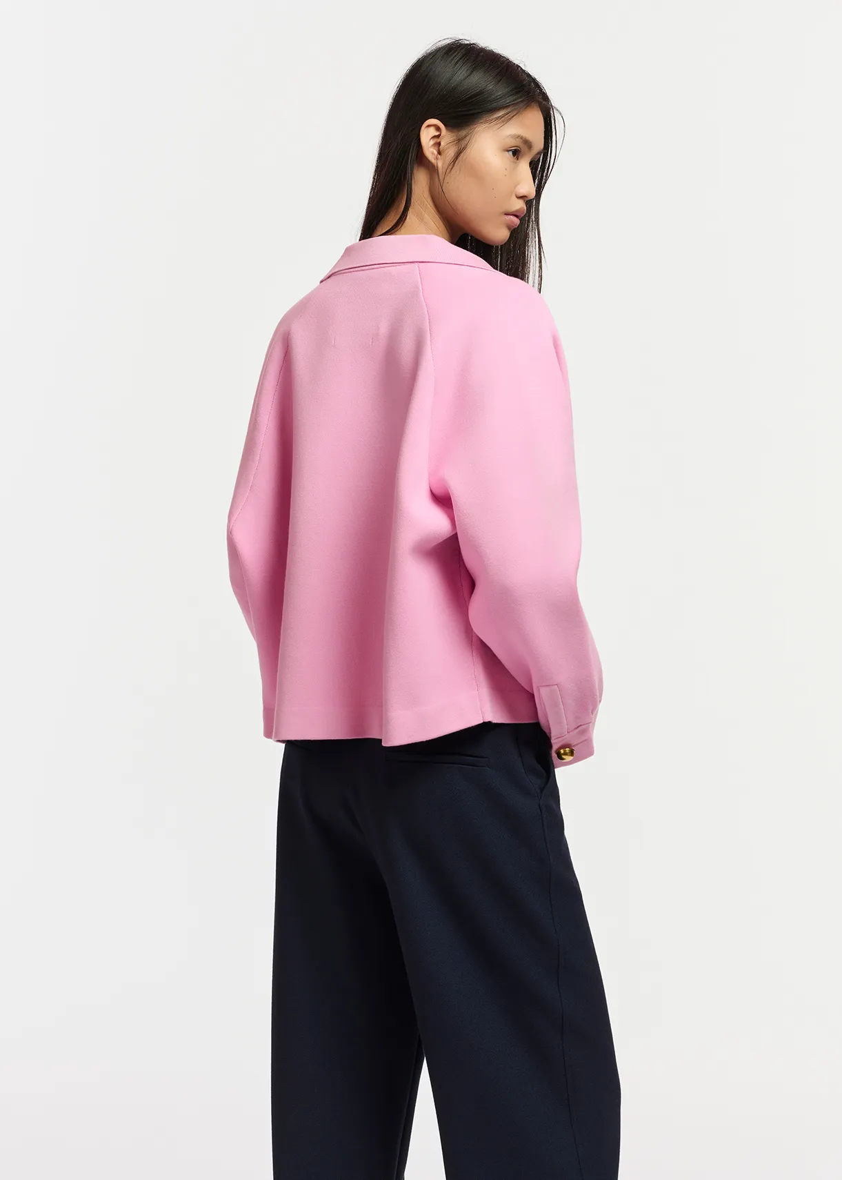 Pink knitted jacket with faux leather patch pockets