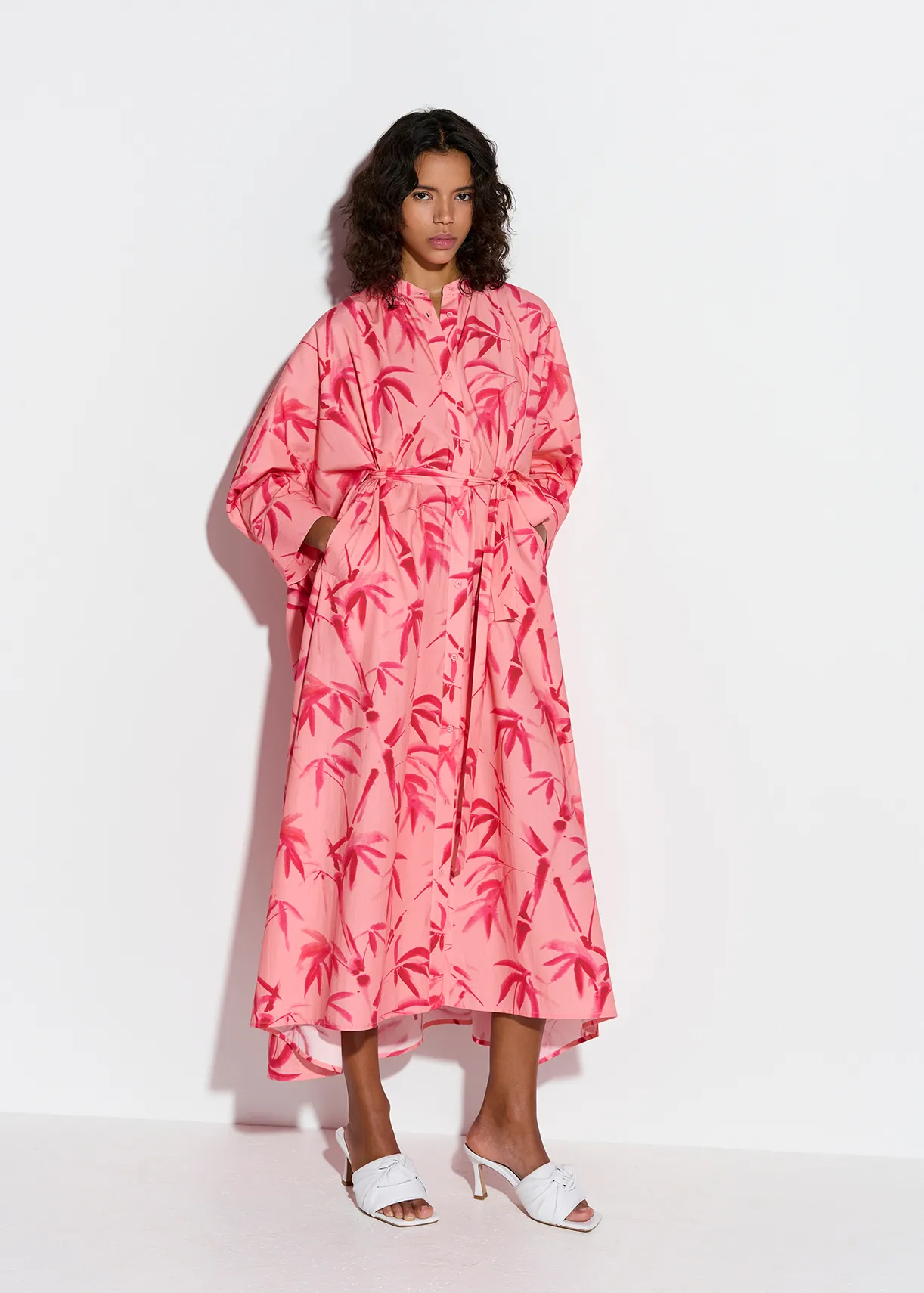 Peach and pink maxi-length dress with palm leaf print