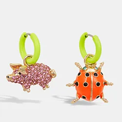 Lime green hoop earrings with pig and ladybug pendants