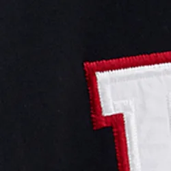 Black cotton sweatpants with embroidered patches