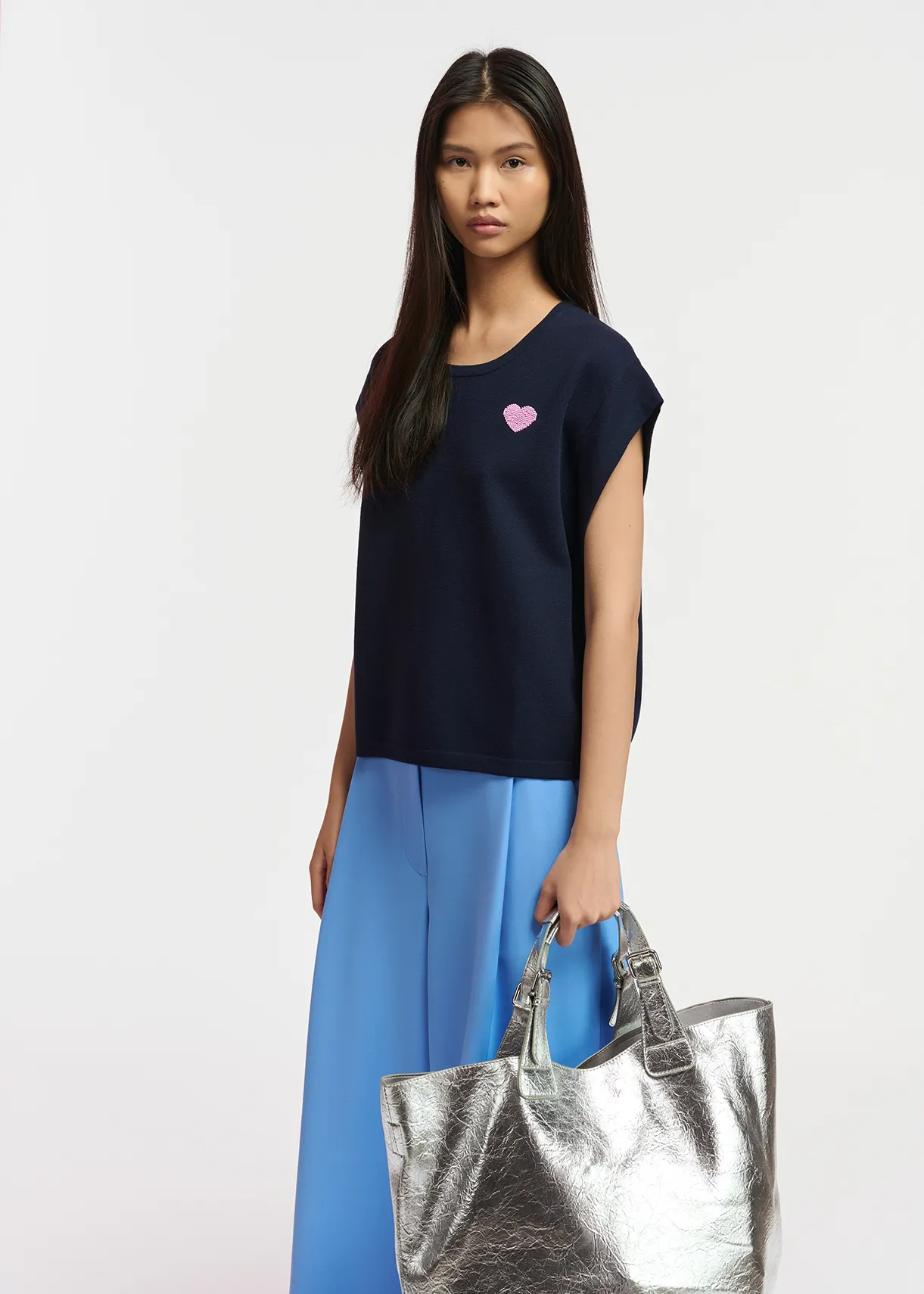 Navy blue sleeveless knitted sweater with beaded embellishment