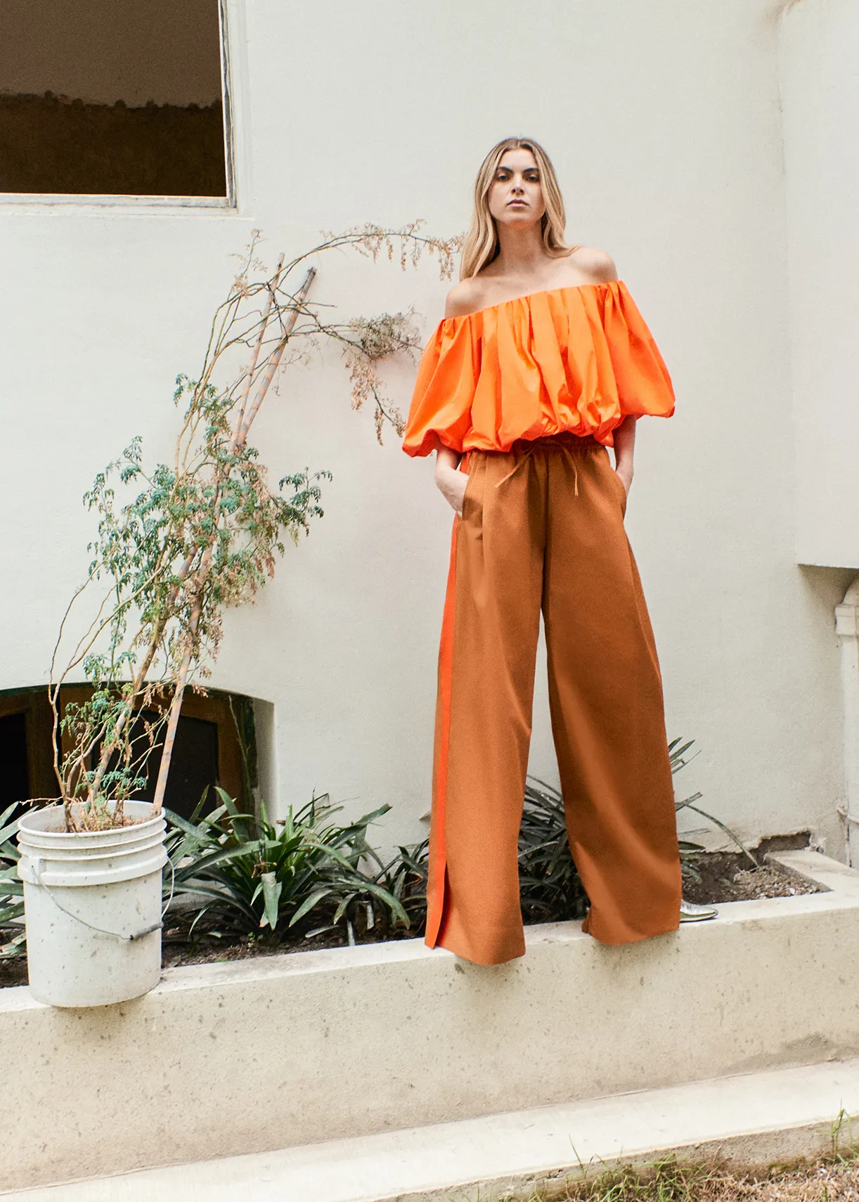 Bronze wide-leg pants with orange stripes