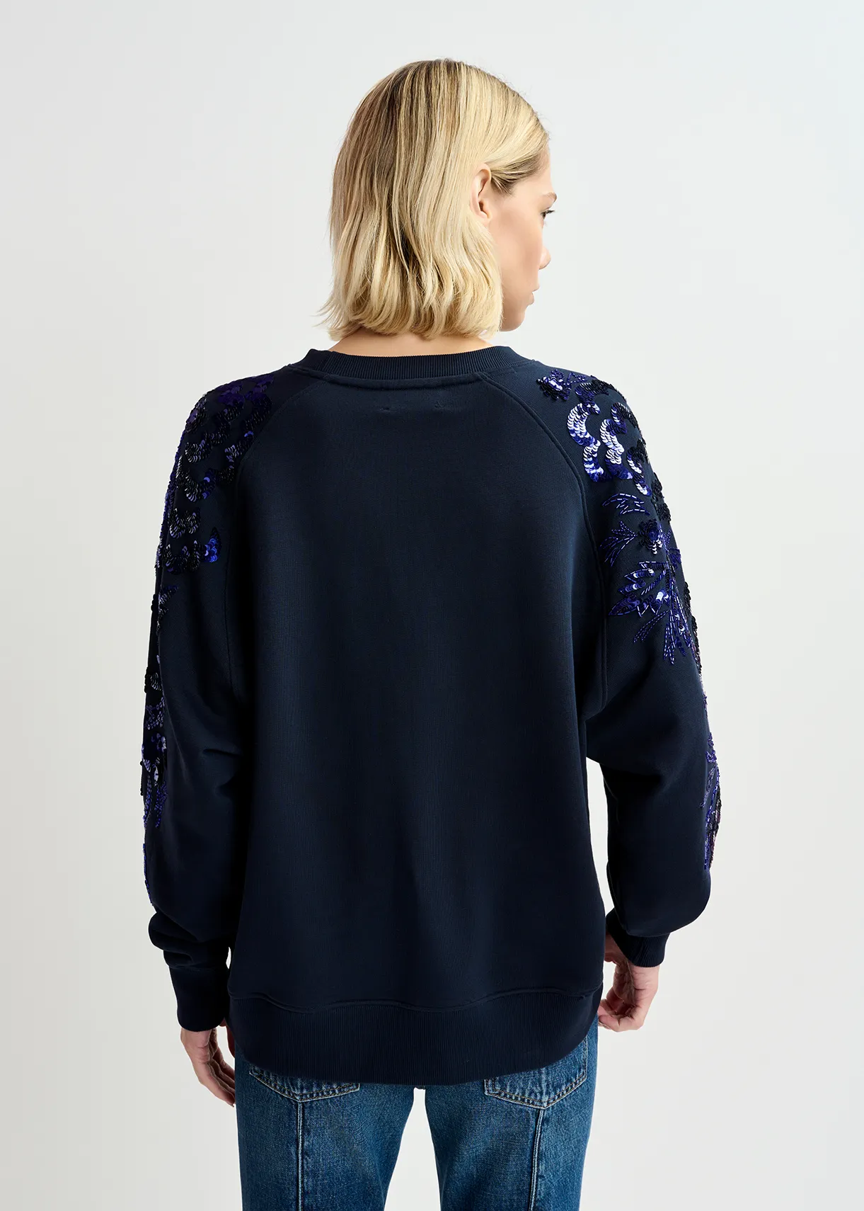 Navy blue organic cotton sweatshirt with sequin and bead-embroidered sleeves