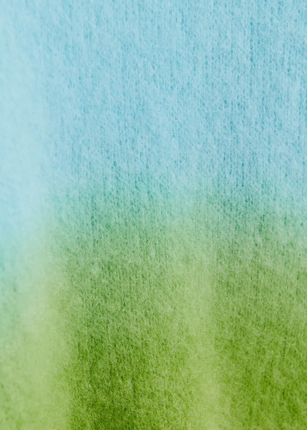 Light blue and green knit sweater with gradient effect