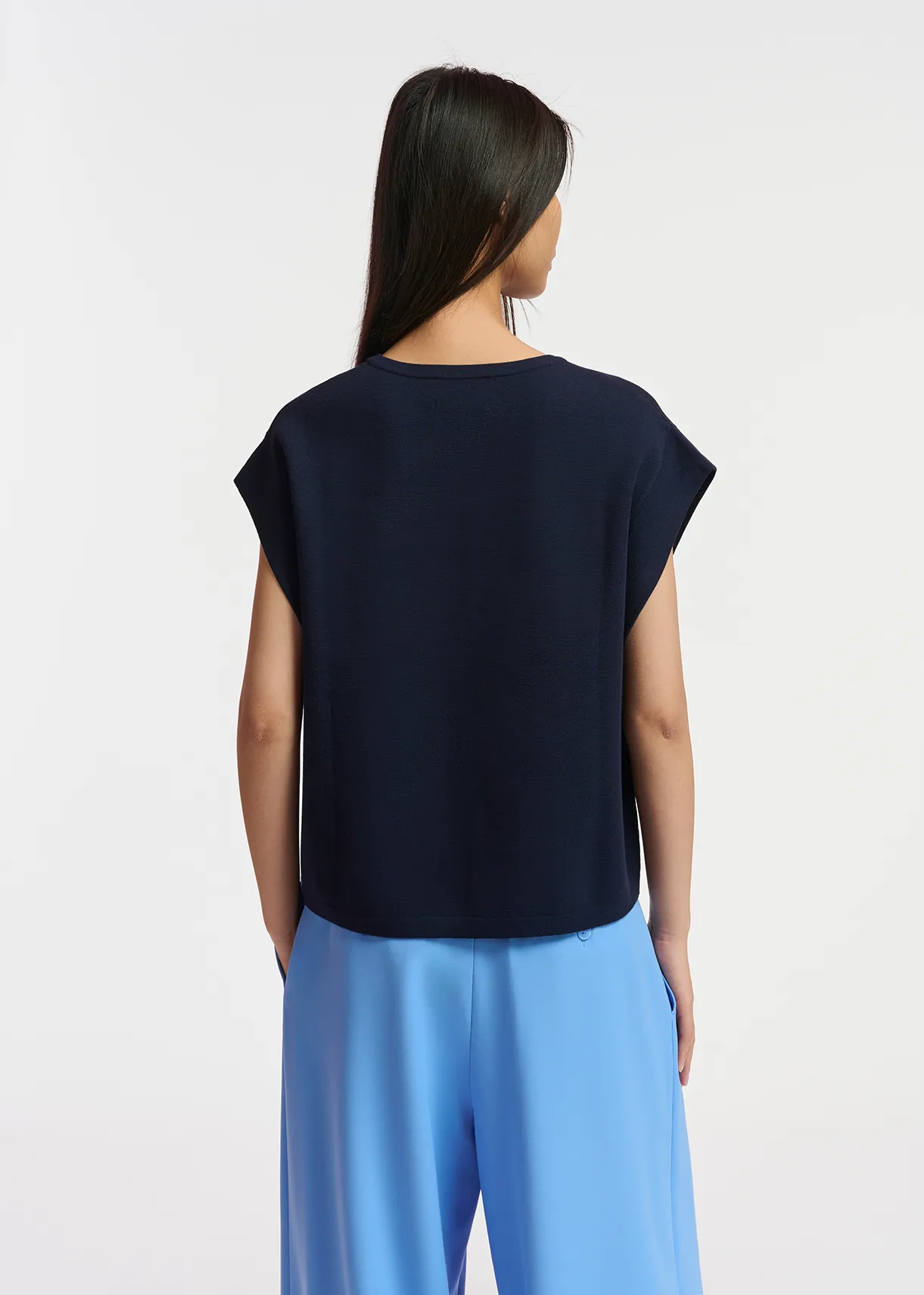 Navy blue sleeveless knitted sweater with beaded embellishment