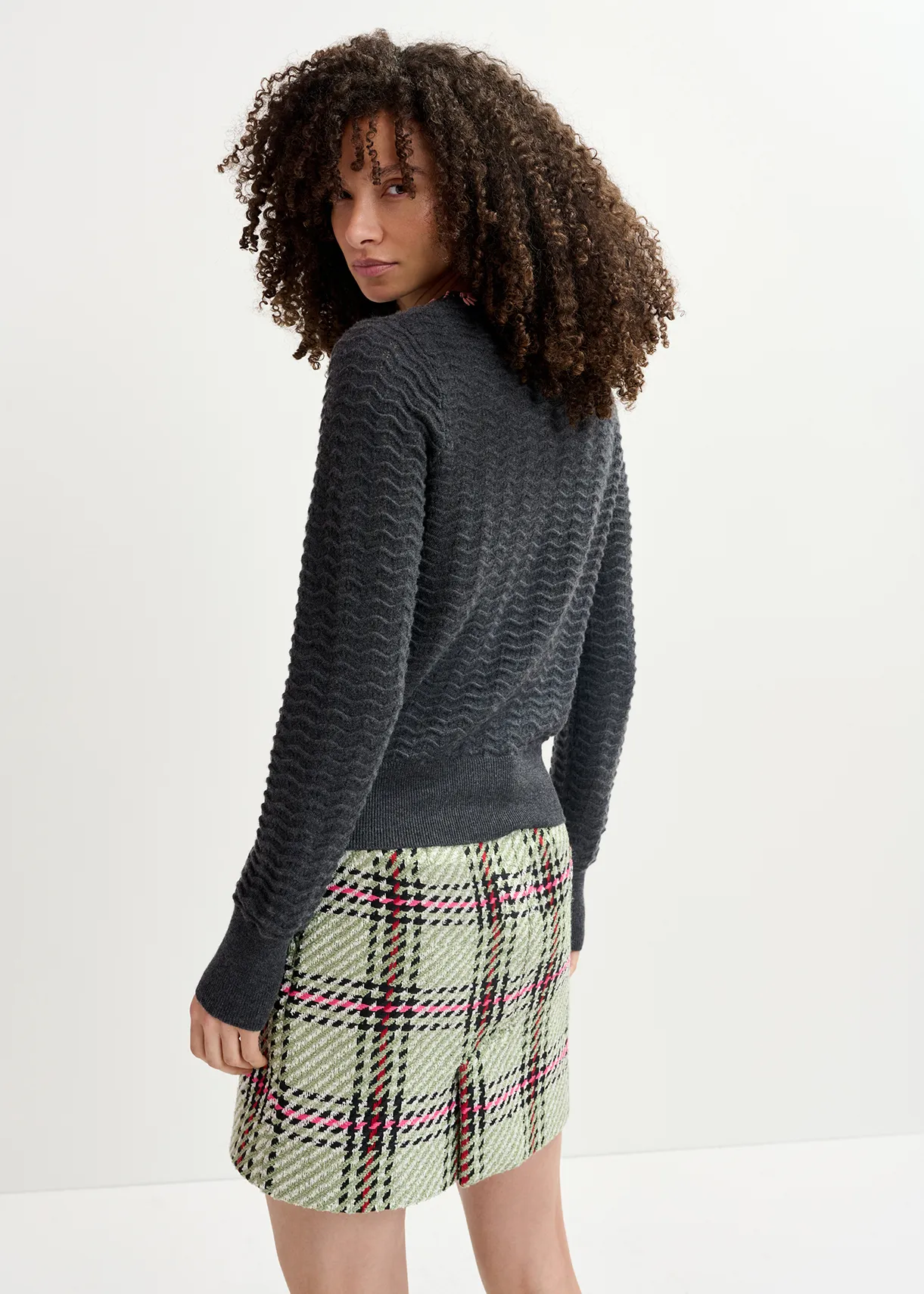 Dark grey knit sweater with embellished neckline