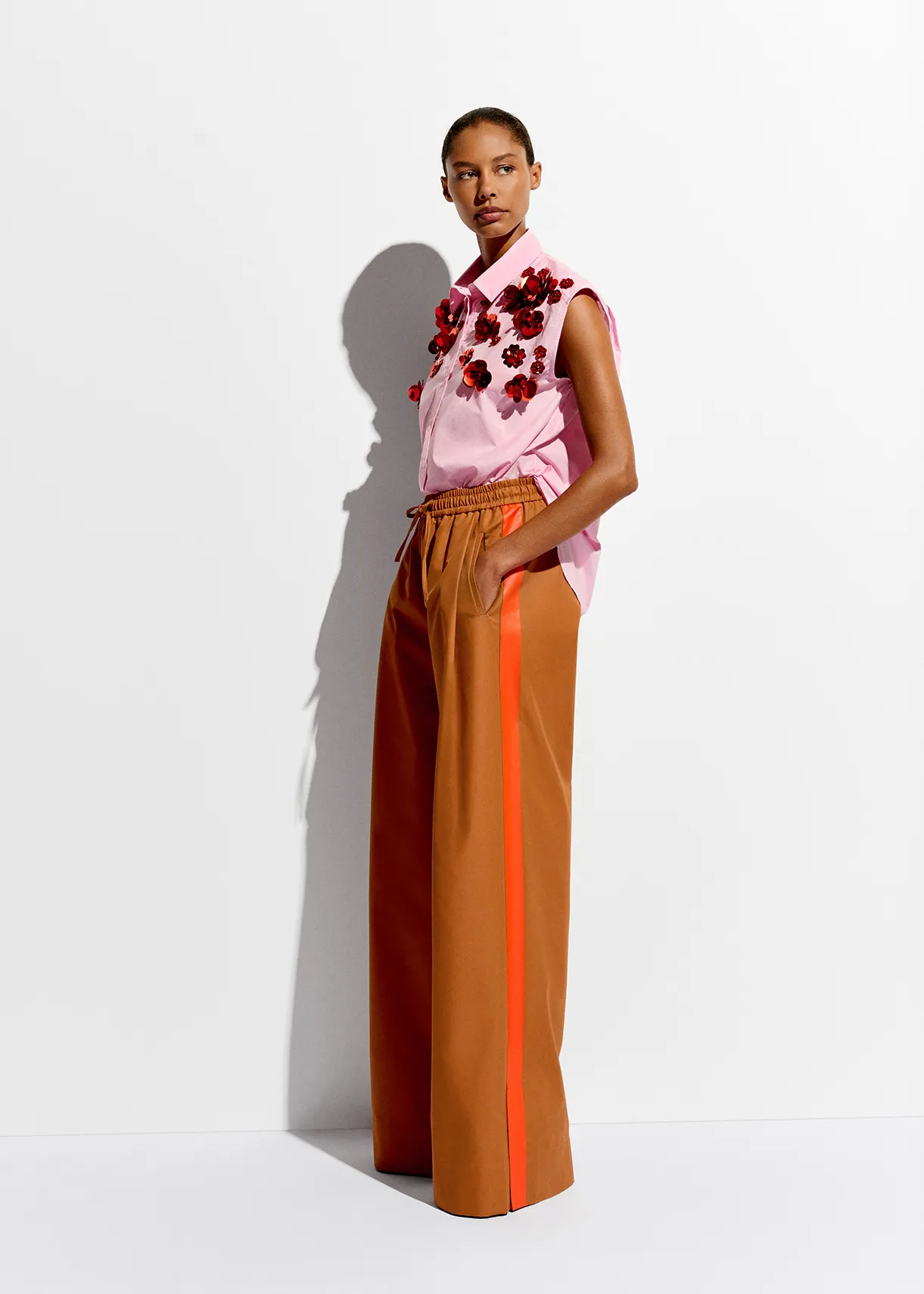 Bronze wide-leg pants with orange stripes