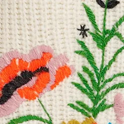 Ecru rib-knitted sweater with floral embroideries