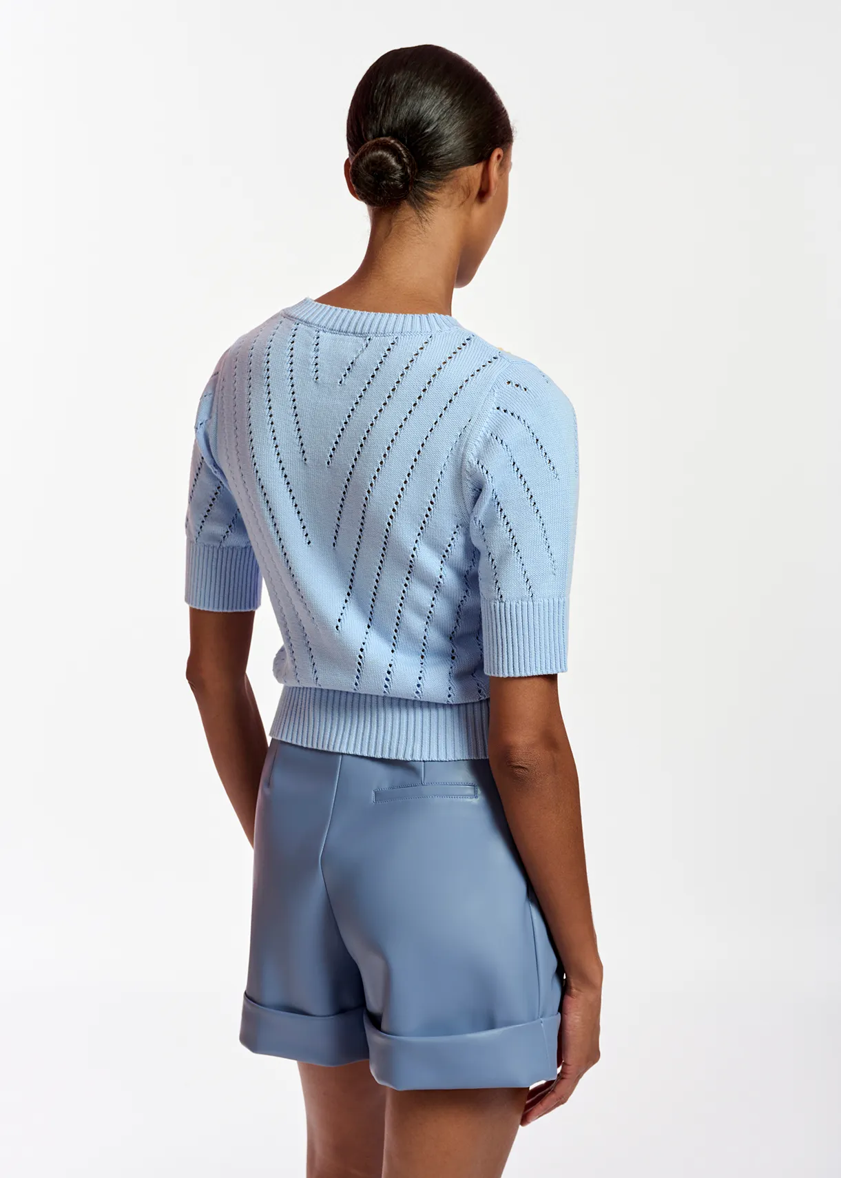 Light blue pointelle-knitted sweater with embroideries