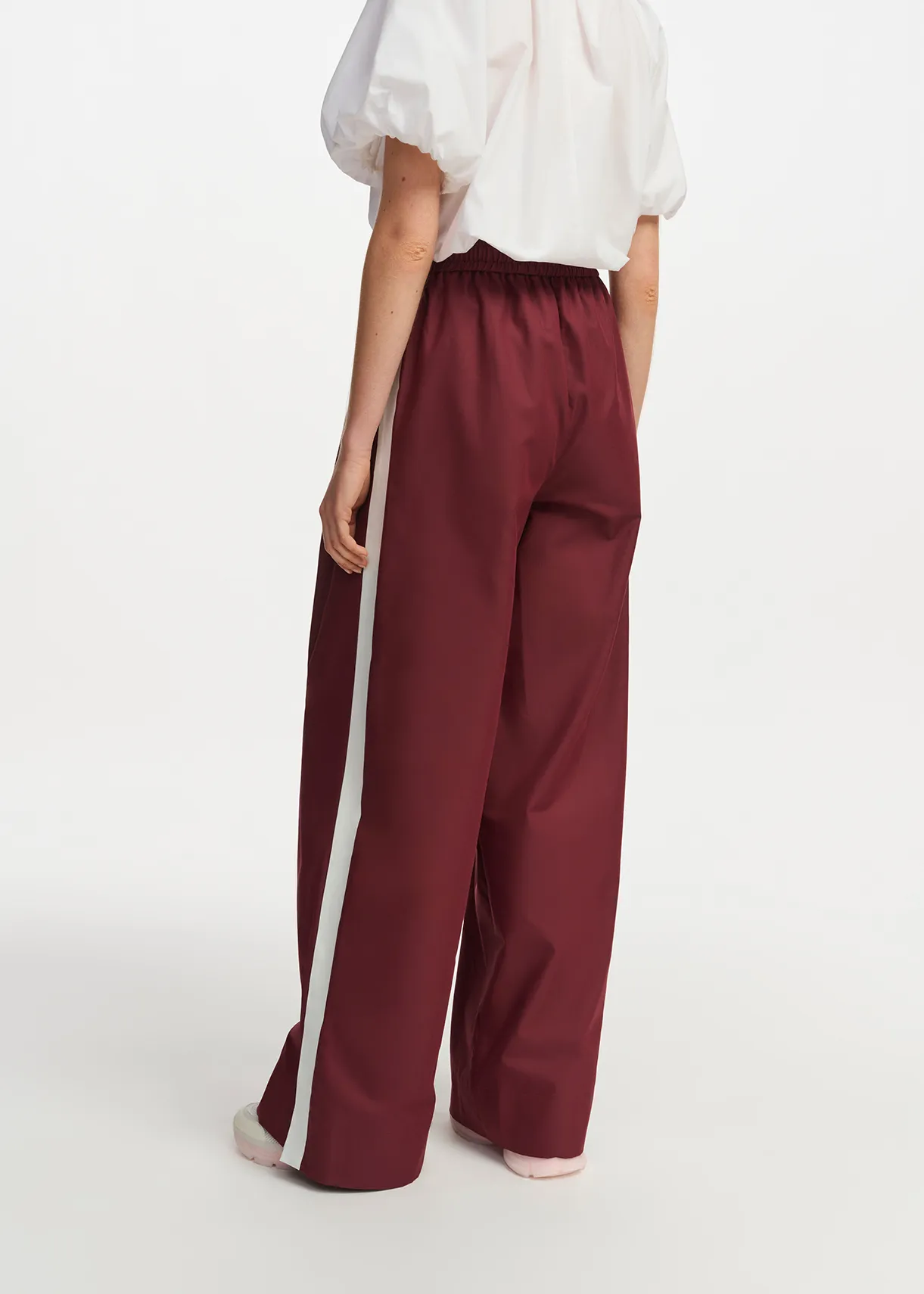 Burgundy wide-leg pants with white stripes