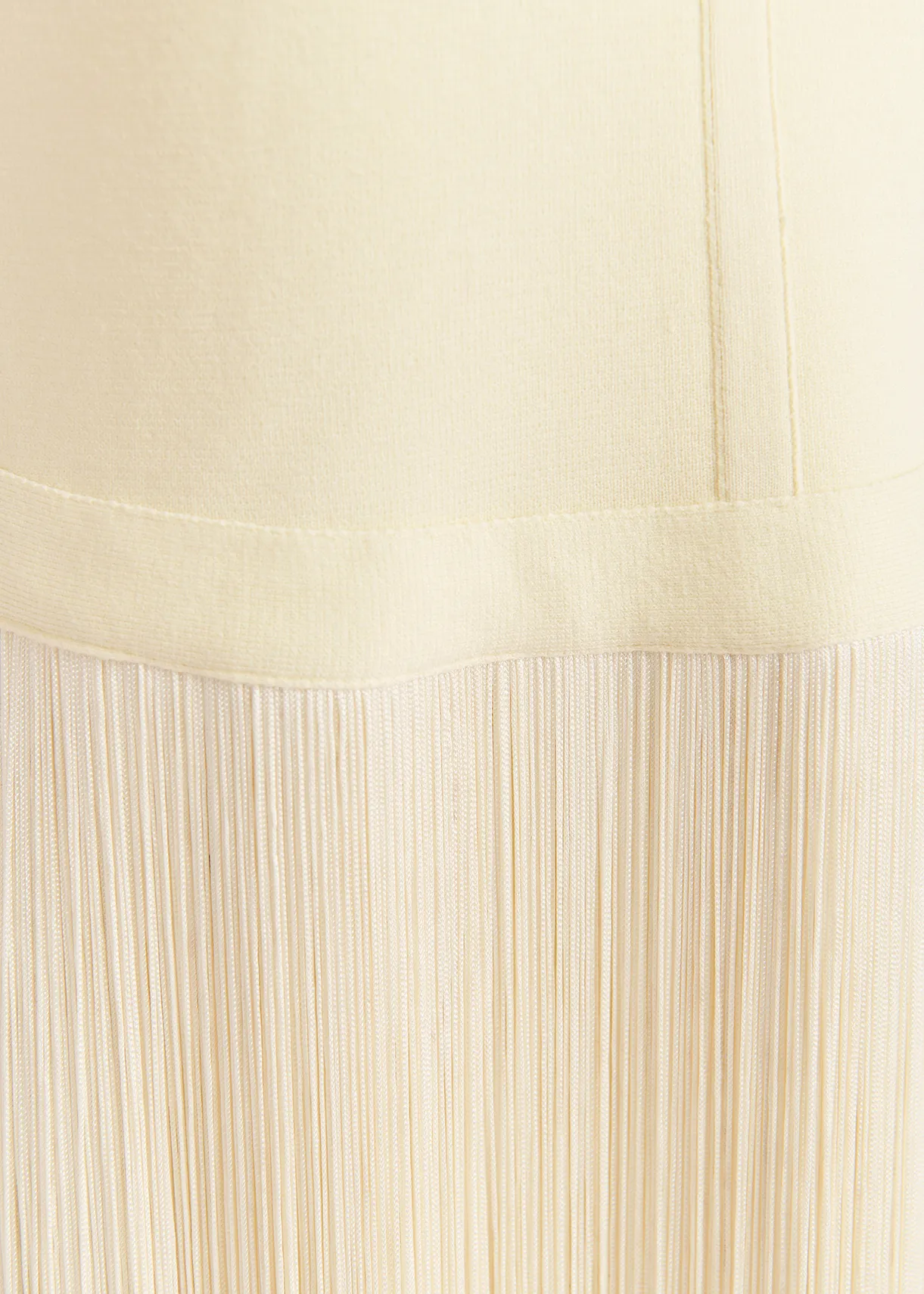 Ecru knitted top with long fringes
